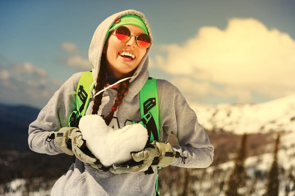A happy skier showing the benefits of skiing 
