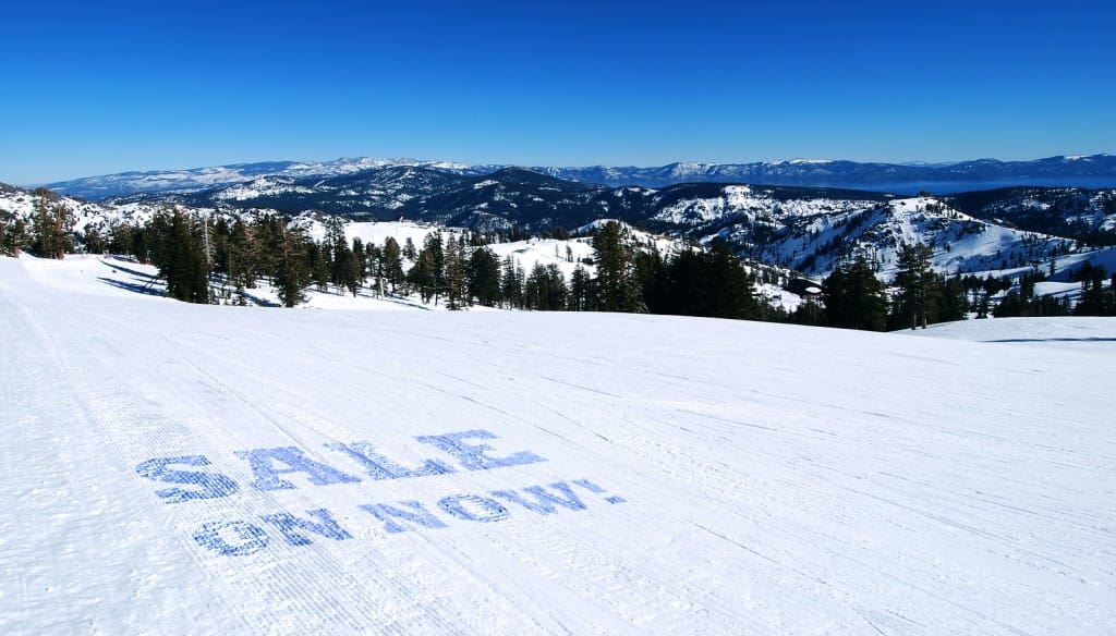 Sale On Now Text on White Snow in Alpine Setting