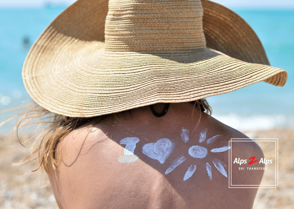 A lady with a sun hat on enjoying summer in the Alps